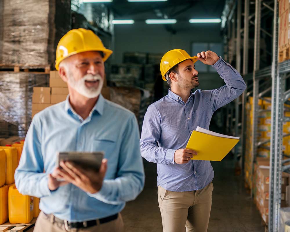 family-business-inventory-check a son helps his father perform an inventory check for the family business
